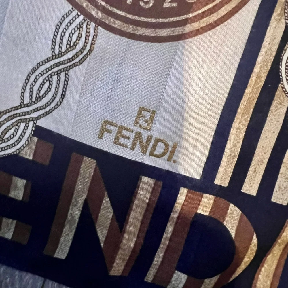 Fendi scarf 23 x 22.5” spend $400 get a free designer scarf valves at $400.